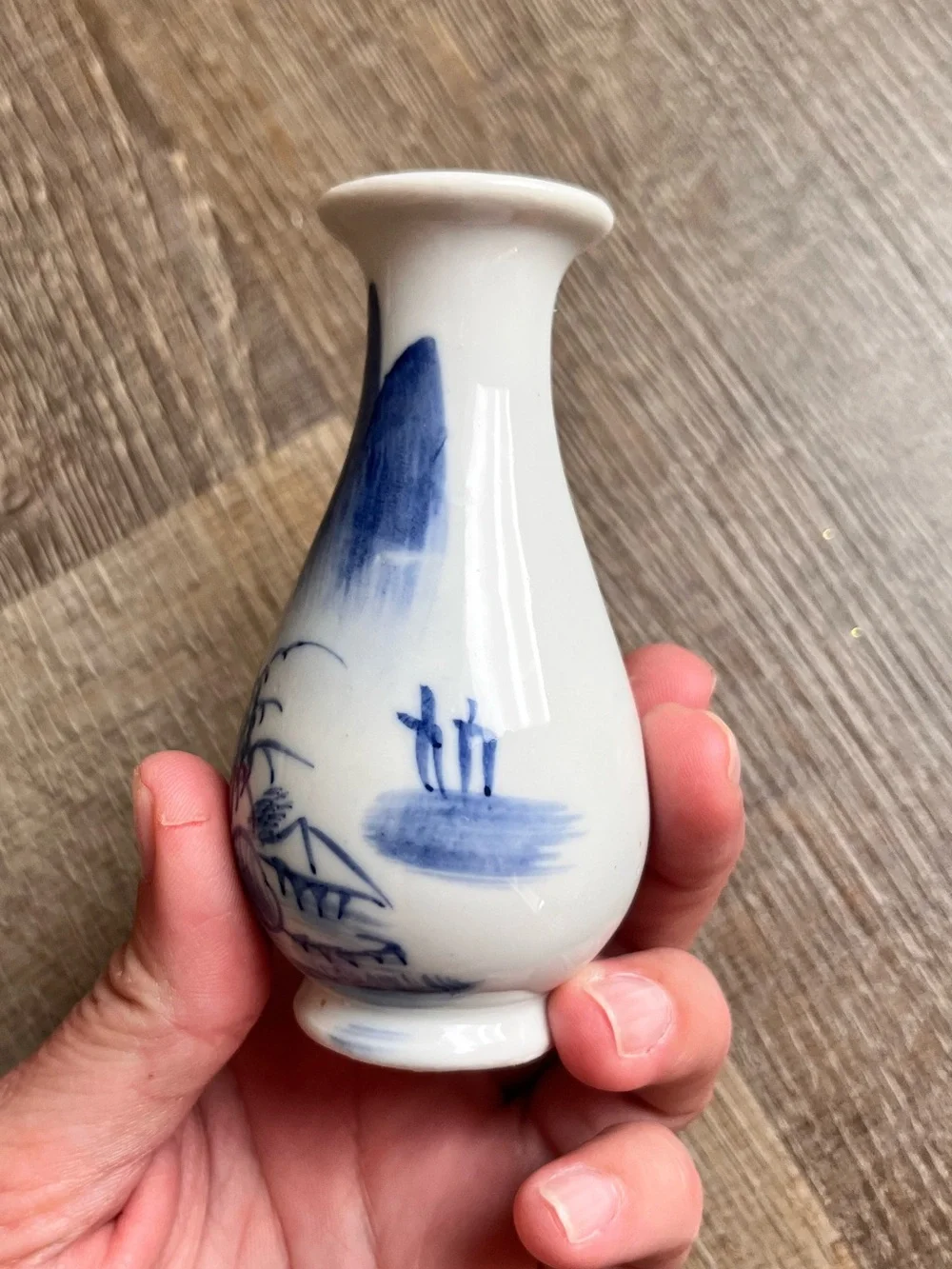 Chinese style porcelain bud vase with a flared rim and hand-painted landscape
